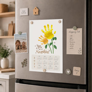 Sunflower handprint art calendar made using a child's painted handprint with printable 2027 calendar design - print it off